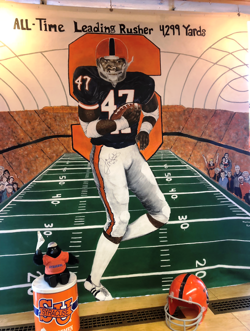 SHS Senior paints mural to honor football player Joe Morris Solvay